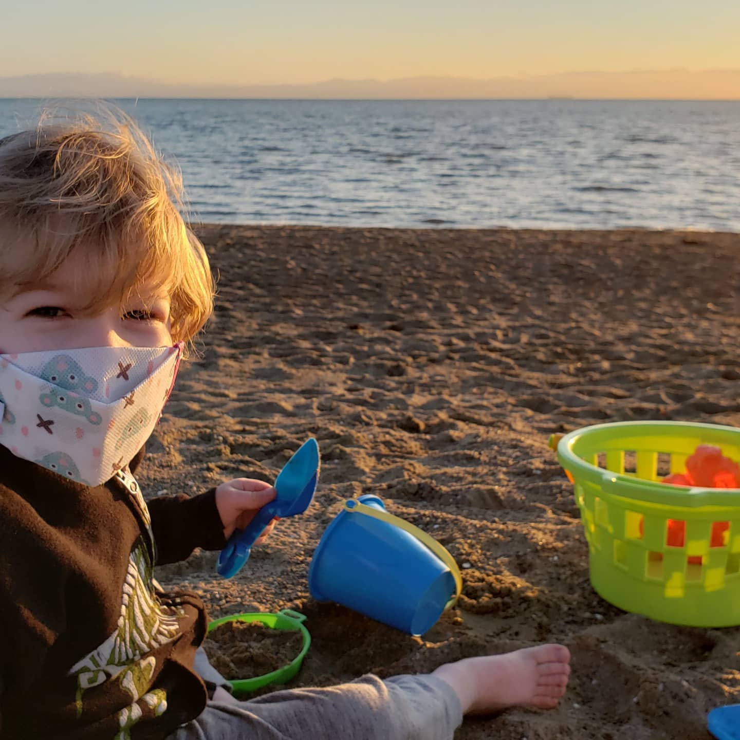 You can still play with sand at the beach even when it is chilly!